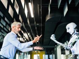 mature business man questioning a robot